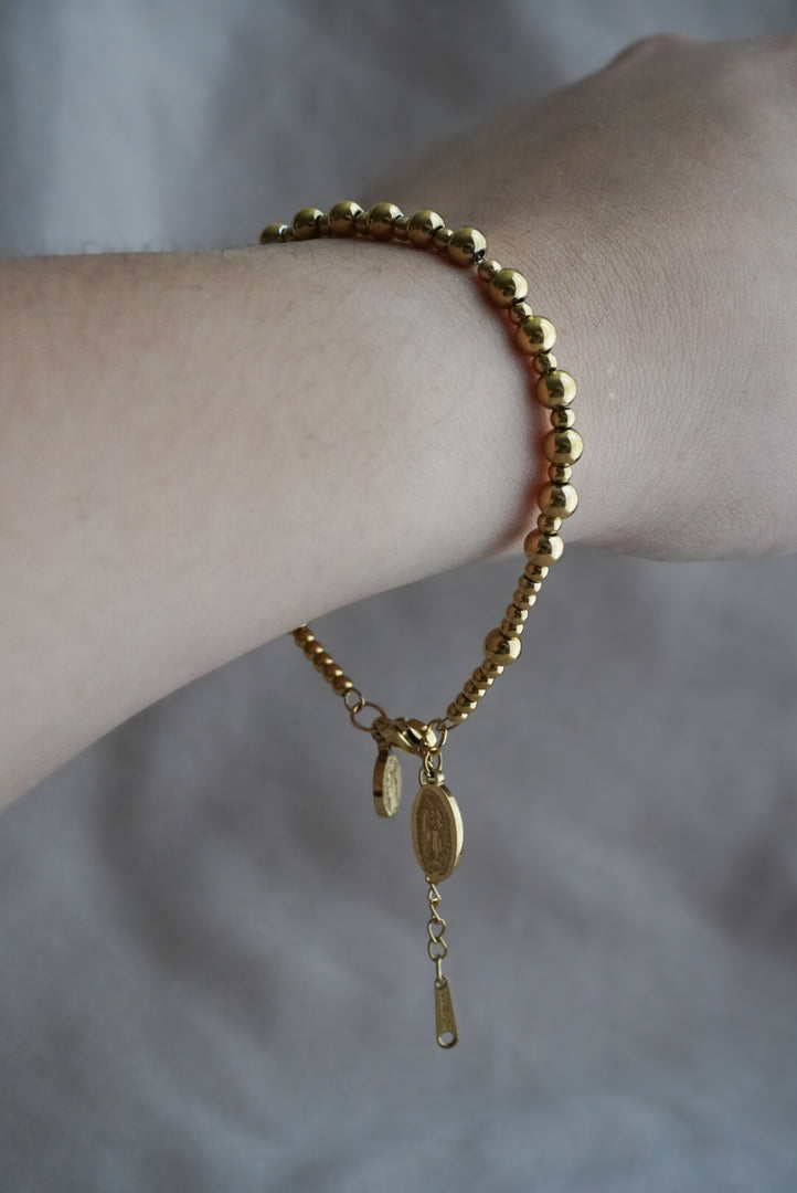Pulsera de acero inoxidable con virgen de Guadalupe y san Benito.