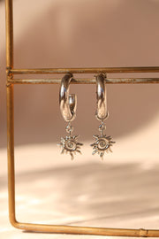 Arracada tubular con sol acero inoxidable