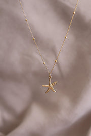 Collar estrella de mar chapa de oro